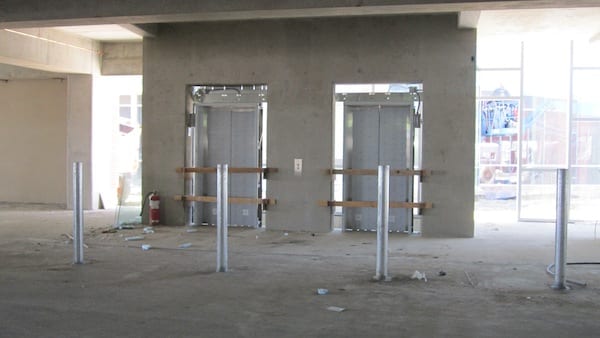 Installing Southeast elevator doors in parking garage